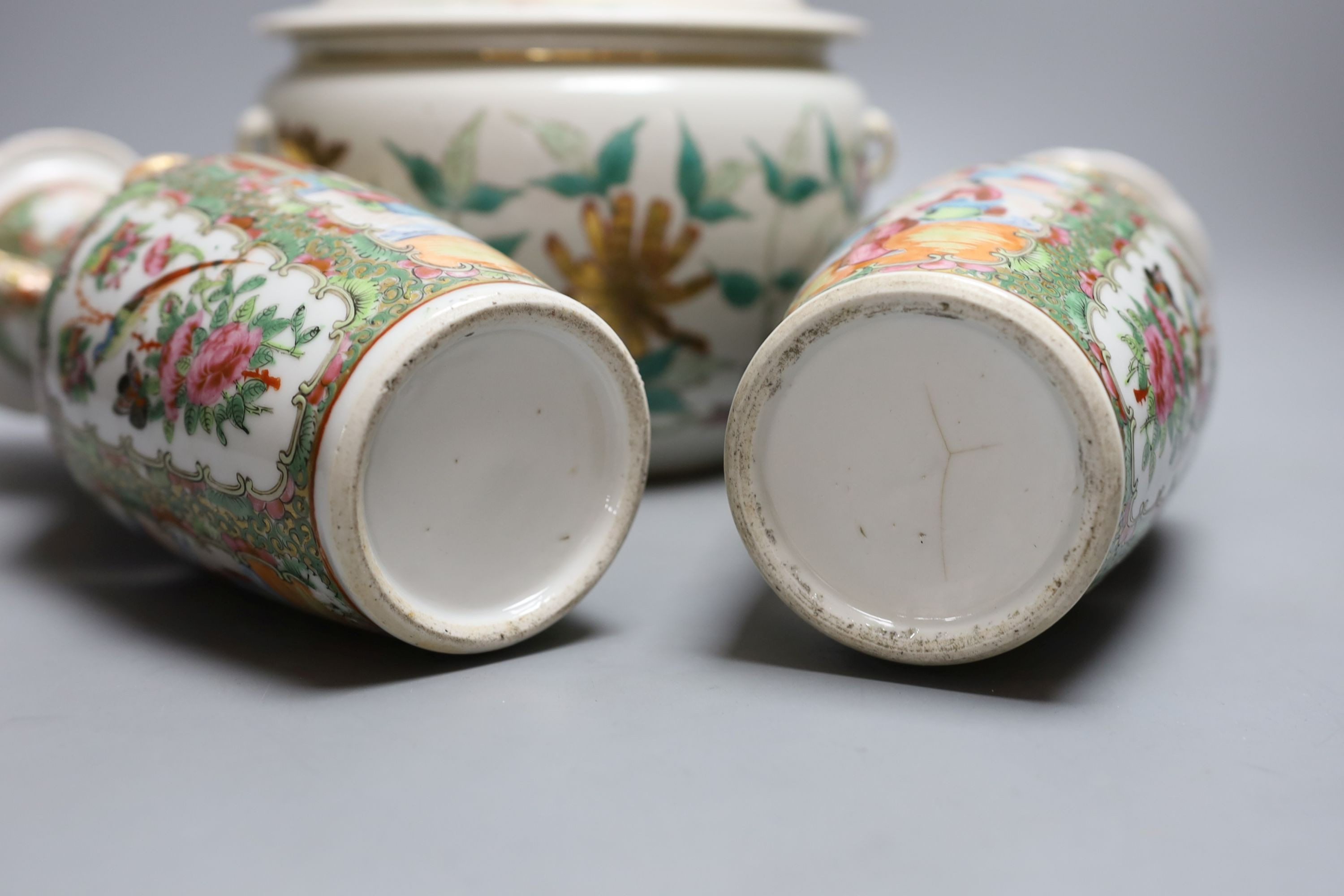 A pair of 19th century famille rose vases, 25cm tall, together with an early 20th century Chinese kamcheng (3)